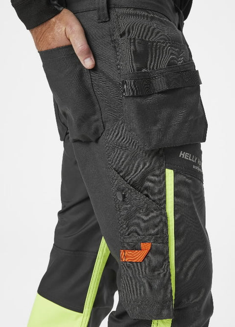 Hi-Vis darba bikses Alna Helly Hansen sānskats ar kabatām