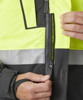 Hi-vis jaka ar YKK rāvējslēdzēju un vēja aizsargu, piemērota uzņēmuma logo apdrukai