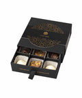 PRALINES šokolādes deserts melnā premium konfekšu kastē
